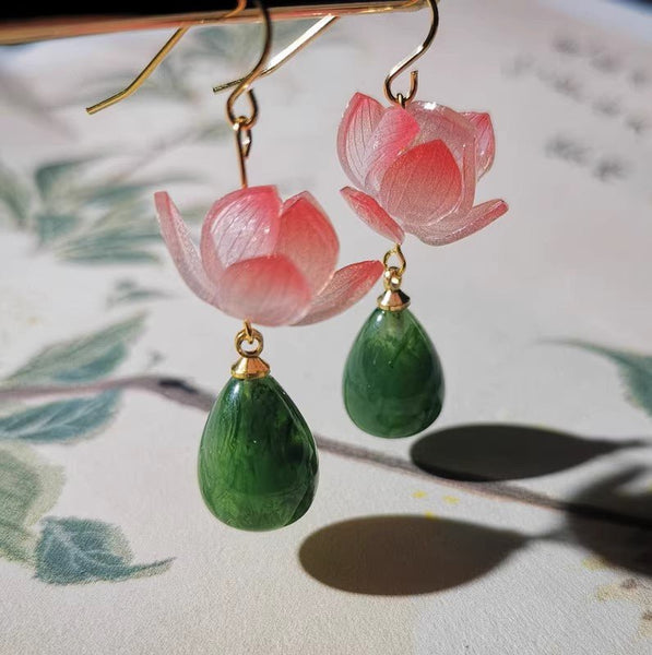 Earrings with six-petal flowers and good central tourmaline