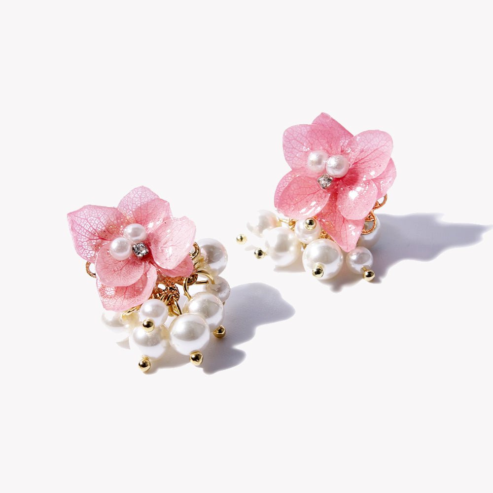 Earrings with ceramic good pearls in white, cherry blossoms in lilac and purple